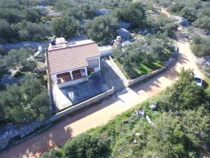 an aerial view of a house with a roof at Holiday Home Nada in Sali