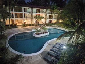 The swimming pool at or close to Hotel Plaza Palenque