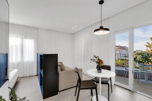 a living room with a table and a couch at Apartments Villa Lili in Tučepi