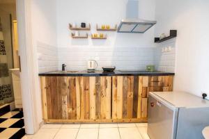 a kitchen with a wooden counter with a sink at Kanoni Garden Studio in Kanoni