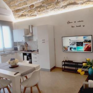 Kuchyň nebo kuchyňský kout v ubytování Agorà Home