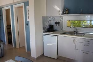 Kuchyň nebo kuchyňský kout v ubytování Mathesi Apartment Sea View