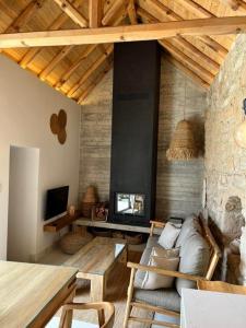 a living room with a couch and a table at Mikro1890 in Mesogi
