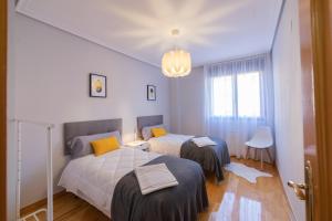 Postel nebo postele na pokoji v ubytování Apartamento Albelda Centro