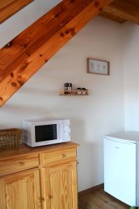 Kuchyň nebo kuchyňský kout v ubytování Apartmány Réví