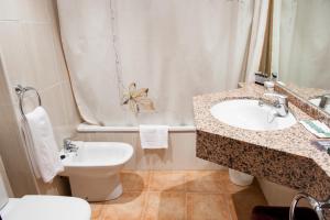 a bathroom with a sink and a toilet at El Pilar in Benasque +60 photos