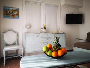 a bowl of fruit on a table in a living room at Sea&Sun Glyfada Apartment in Athens