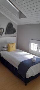 Postel nebo postele na pokoji v ubytování 66 @ The Dunes