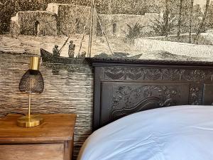 Ένα ή περισσότερα κρεβάτια σε δωμάτιο στο Villa du Palmier