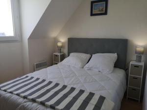 Postel nebo postele na pokoji v ubytování Résidence Long Island