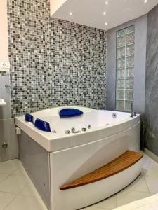 a bath tub in a bathroom with at La Baita Del Re Resort in Ottaviano