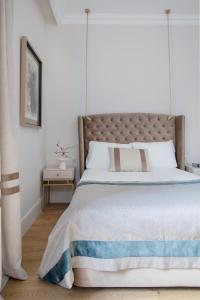 Кровать или кровати в номере Palacio Tirso de Molina - THE ARC COLLECTION