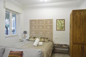 Säng eller sängar i ett rum på FLEMING Loft PARKING Tourist Córdoba