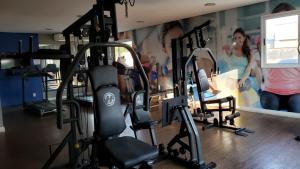 a gym with several tread machines in a room at Life Ponta Negra in Manaus