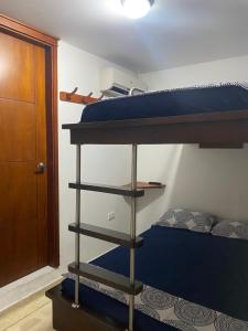 Postel nebo postele na pokoji v ubytování Hostal El Recreo