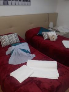 A bed or beds in a room at AFFITTACAMERE Il Cortile