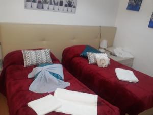 A bed or beds in a room at AFFITTACAMERE Il Cortile