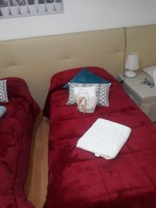 A bed or beds in a room at AFFITTACAMERE Il Cortile