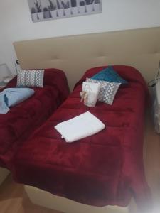 A bed or beds in a room at AFFITTACAMERE Il Cortile