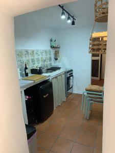 a kitchen with a sink and a stove at La Cueva de Alabama in Mijas