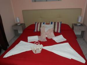 A bed or beds in a room at AFFITTACAMERE Il Cortile