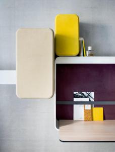 a white suitcase sitting on top of a wooden table at Okko Hotels Lyon Pont Lafayette in Lyon