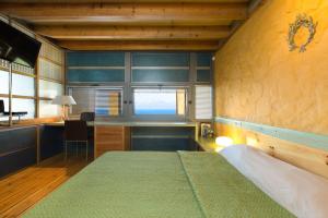 Postel nebo postele na pokoji v ubytování Ravdoucha Epavlis - Luxury Private Villas + 37 fotografií