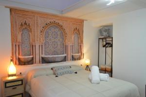 Postel nebo postele na pokoji v ubytování ALCAZAR VIEJO PARKING Tourist Córdoba