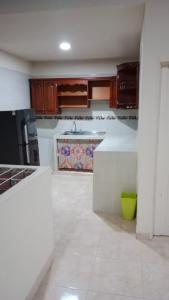 a kitchen with a sink and a counter top at Hospedaje El Cerrito 2 in El Cerrito