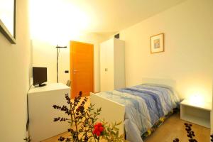 A bed or beds in a room at Bed and Breakfast La Sosta