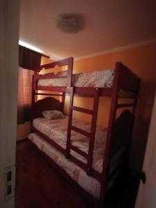 a bedroom with two bunk beds in a room at Departamento Vistamar 2 Puertas Pacifico in Arica