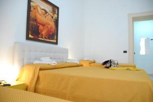 Messina41 Hotel客房内的一张或多张床位