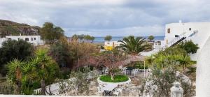 an aerial view of a resort with trees and buildings at Elia in Skala