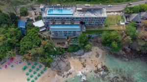 an aerial view of a hotel on the beach at Norn Talay Surin Beach Phuket in Surin Beach