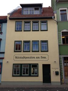 a building with the sign for the subway preservation system am at Altstadtpension am Dom in Erfurt