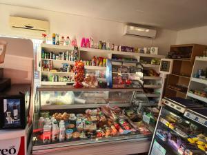 a refrigerator filled with lots of different types of food at Hotel Safta Residence in Craiova