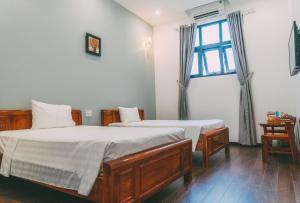 Una cama o camas en una habitación de Bamboo Hotel