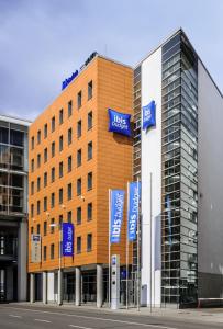 a large building with a sign on the side of it at Ibis budget Hannover Hbf in Hannover