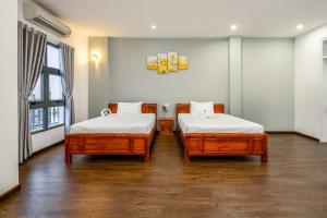 Una cama o camas en una habitación de Bamboo Hotel