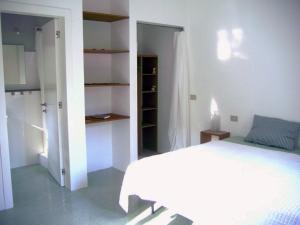 Postel nebo postele na pokoji v ubytování B&B Il Grotto