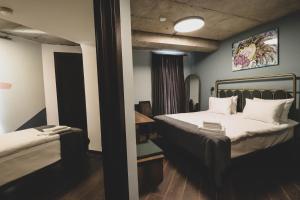 Letto o letti in una camera di Paliani Hotel