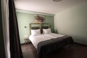 Letto o letti in una camera di Paliani Hotel