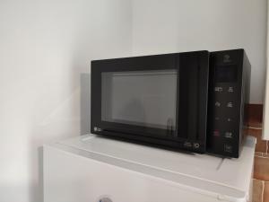 A television and/or entertainment centre at MOLO 78 Case Vacanze