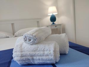 A bed or beds in a room at MOLO 78 Case Vacanze