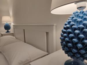 A bed or beds in a room at MOLO 78 Case Vacanze