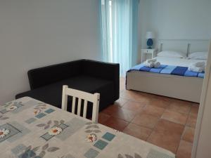 A bed or beds in a room at MOLO 78 Case Vacanze
