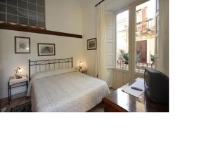 Кровать или кровати в номере Apartment Central 4 Taormina