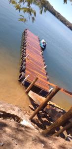 a dock in the water with a boat on it at Caldas Novas Enseada Náutico in Caldas Novas