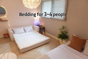 Postel nebo postele na pokoji v ubytování Hostel Mihojae Seomyeon