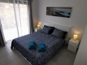 Ένα ή περισσότερα κρεβάτια σε δωμάτιο στο Villaverde Relax 2 a 10 minutos de Corralejo